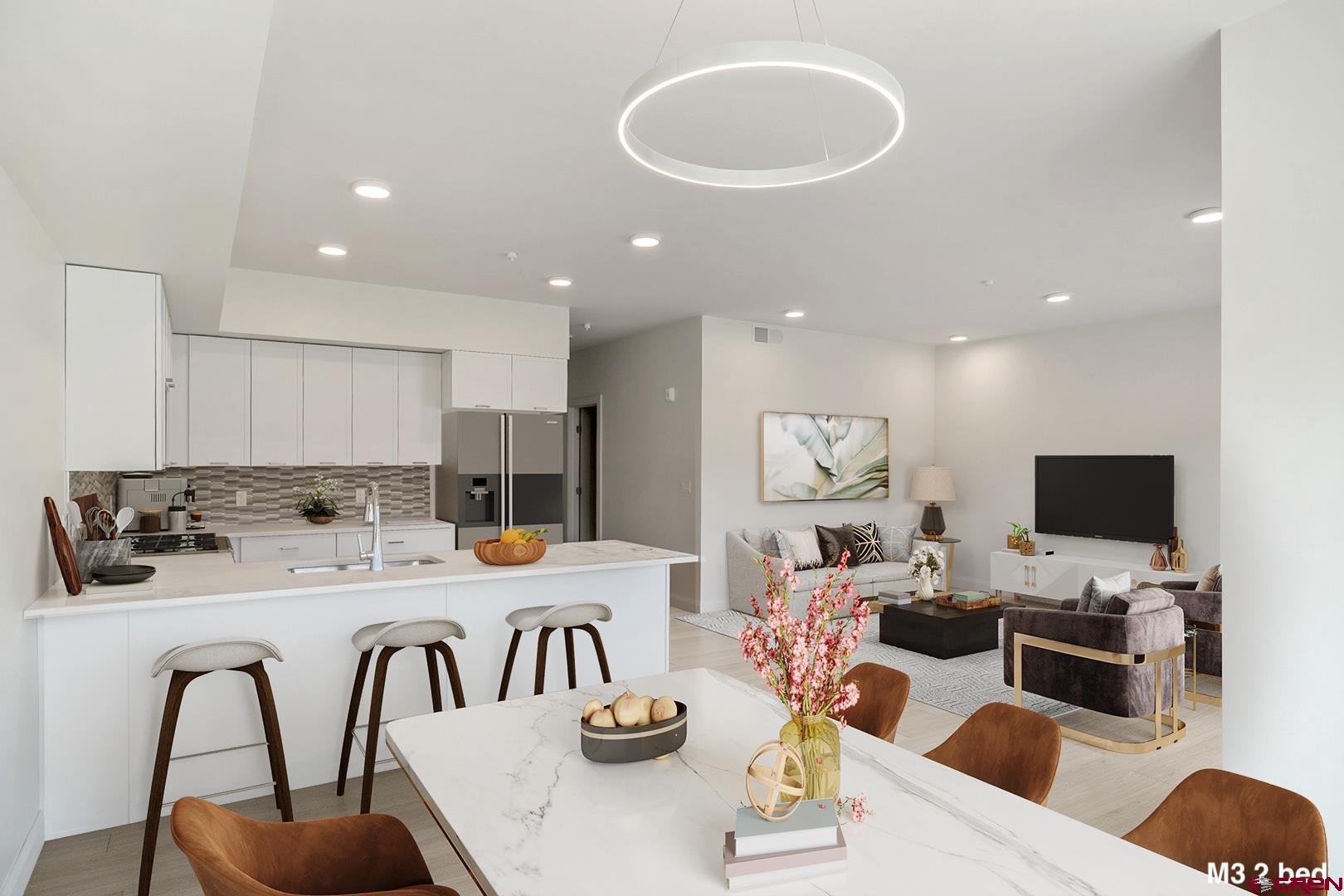 154 Alpine Lane, Unit 200 Ridgway, CO 81432 - Photo 7 of 29 a dining room with furniture a fireplace and a flat screen tv