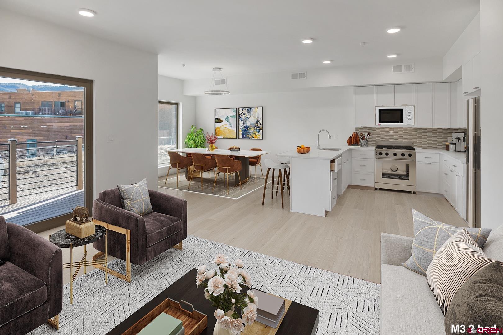 154 Alpine Lane, Unit 200 Ridgway, CO 81432 - Photo 8 of 29 a living room with furniture and a large window