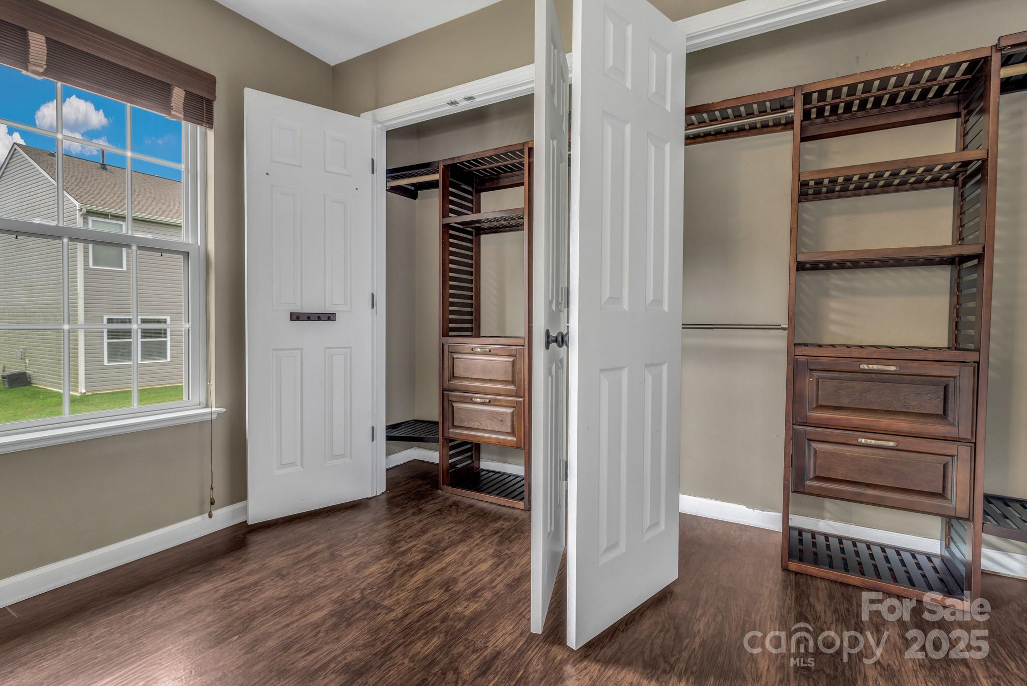 4 Lilac Fields Way Arden, NC 28704 - Photo 23 of 33 a view of walk in closet with empty racks