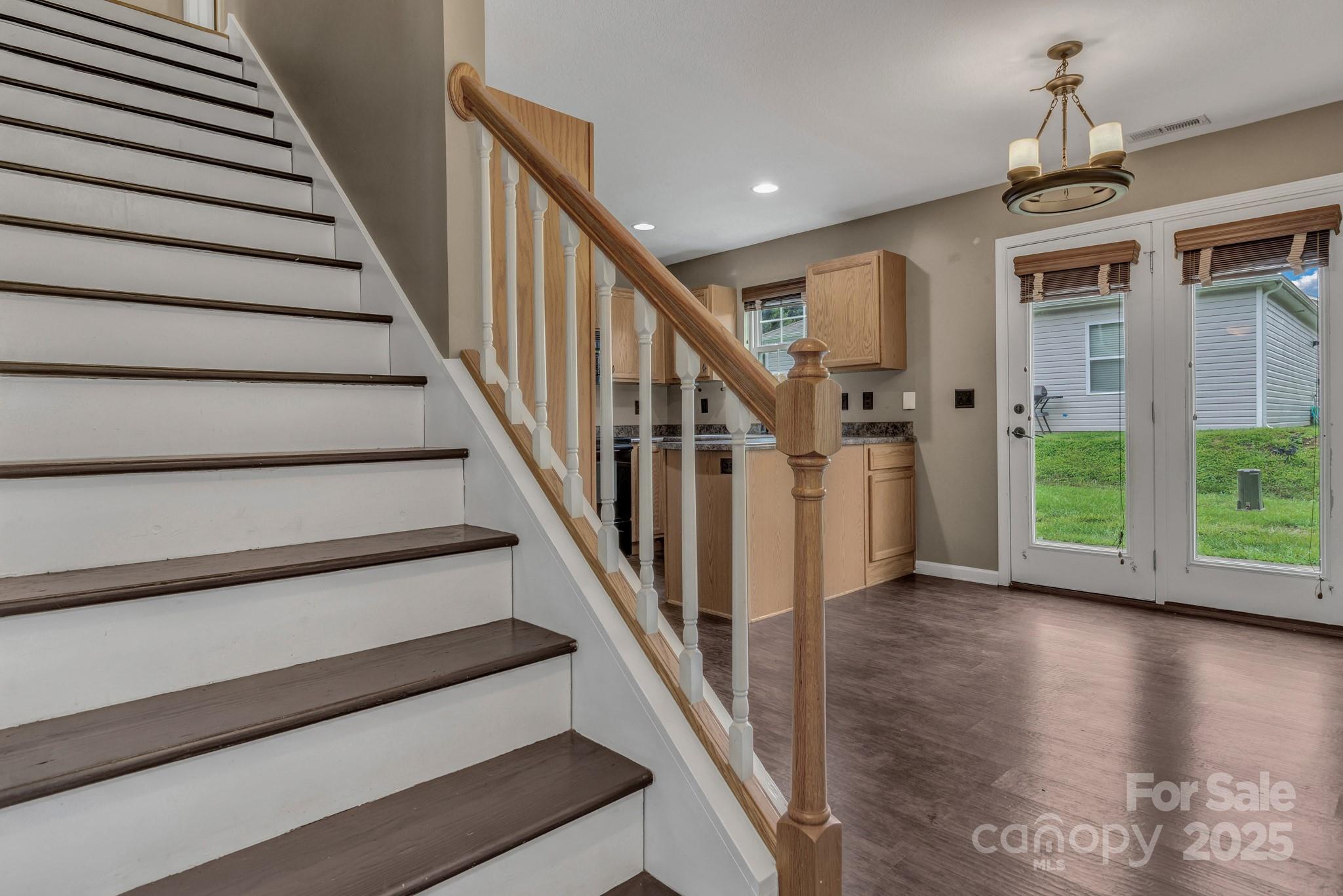 4 Lilac Fields Way Arden, NC 28704 - Photo 29 of 33 a view of entryway with wooden floor and stairs