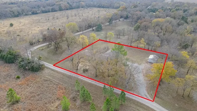 a wooden bench sitting in front of a building