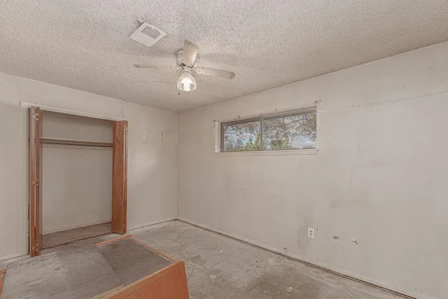 a bathroom with a sink vanity granite and toilet