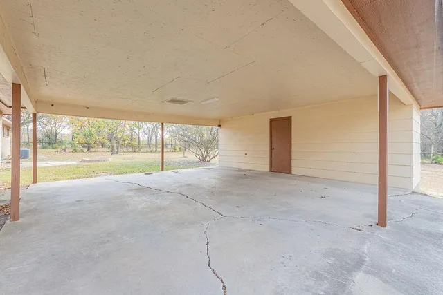 a view of an empty room with a sliding door