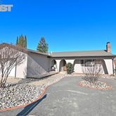 a front view of a house with parking