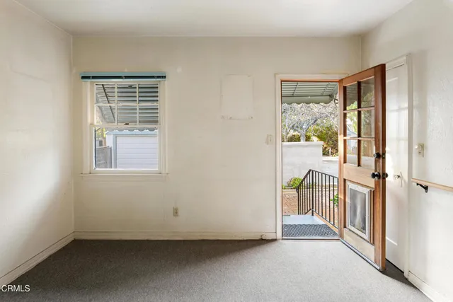 a view of a room with a large window