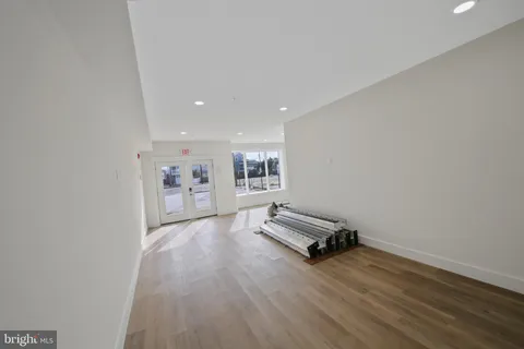 a view of workspace with wooden floor and couch
