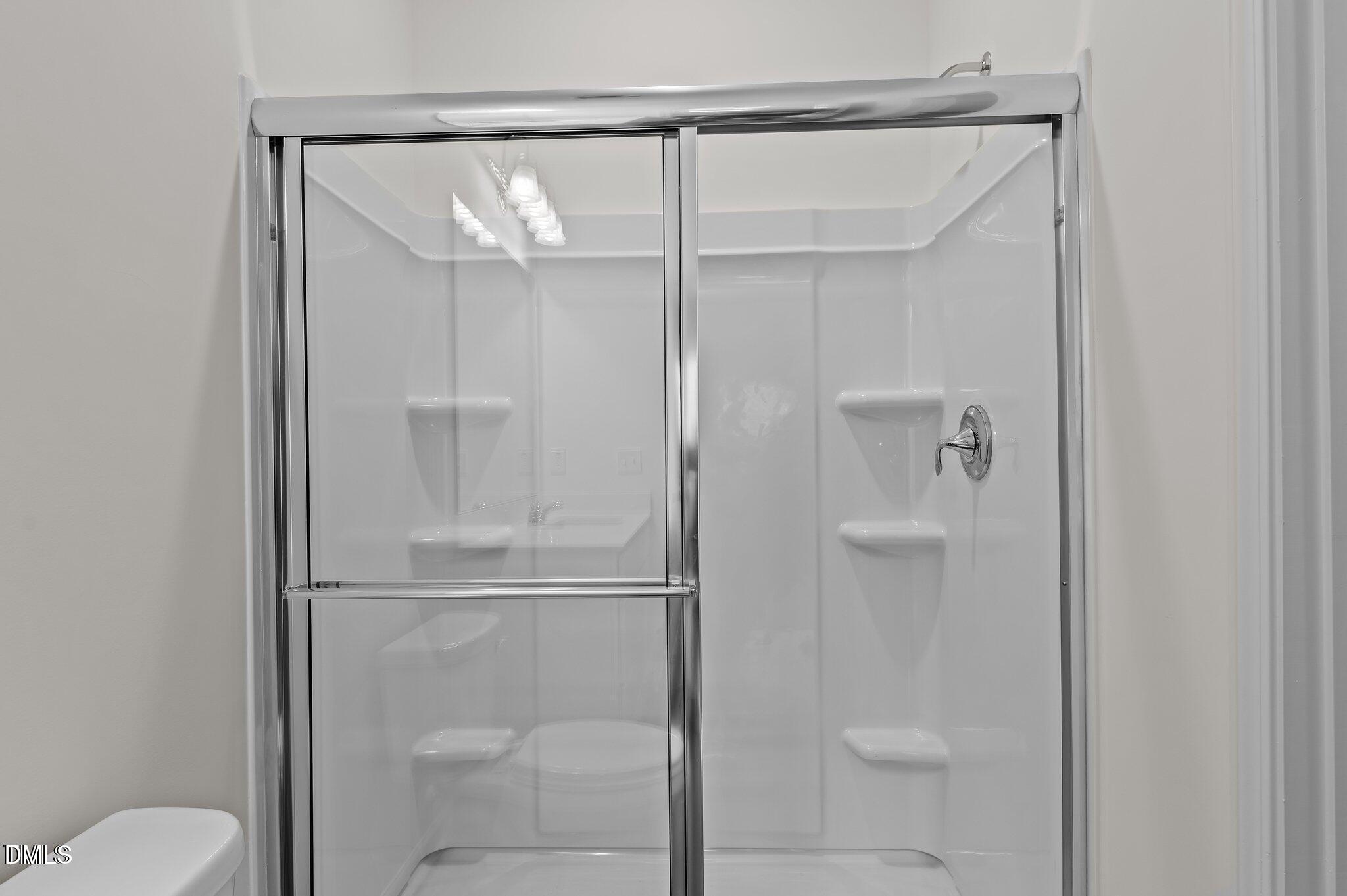 646 Essex Road Nashville, NC 27856 - Photo 11 of 24 a bathroom that has a glass shower door