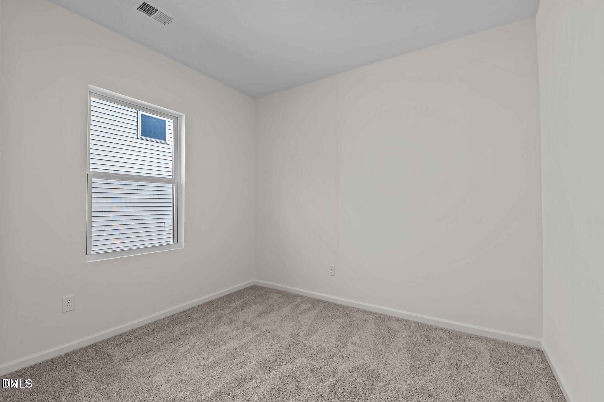 646 Essex Road Nashville, NC 27856 - Photo 15 of 24 an empty room with a window