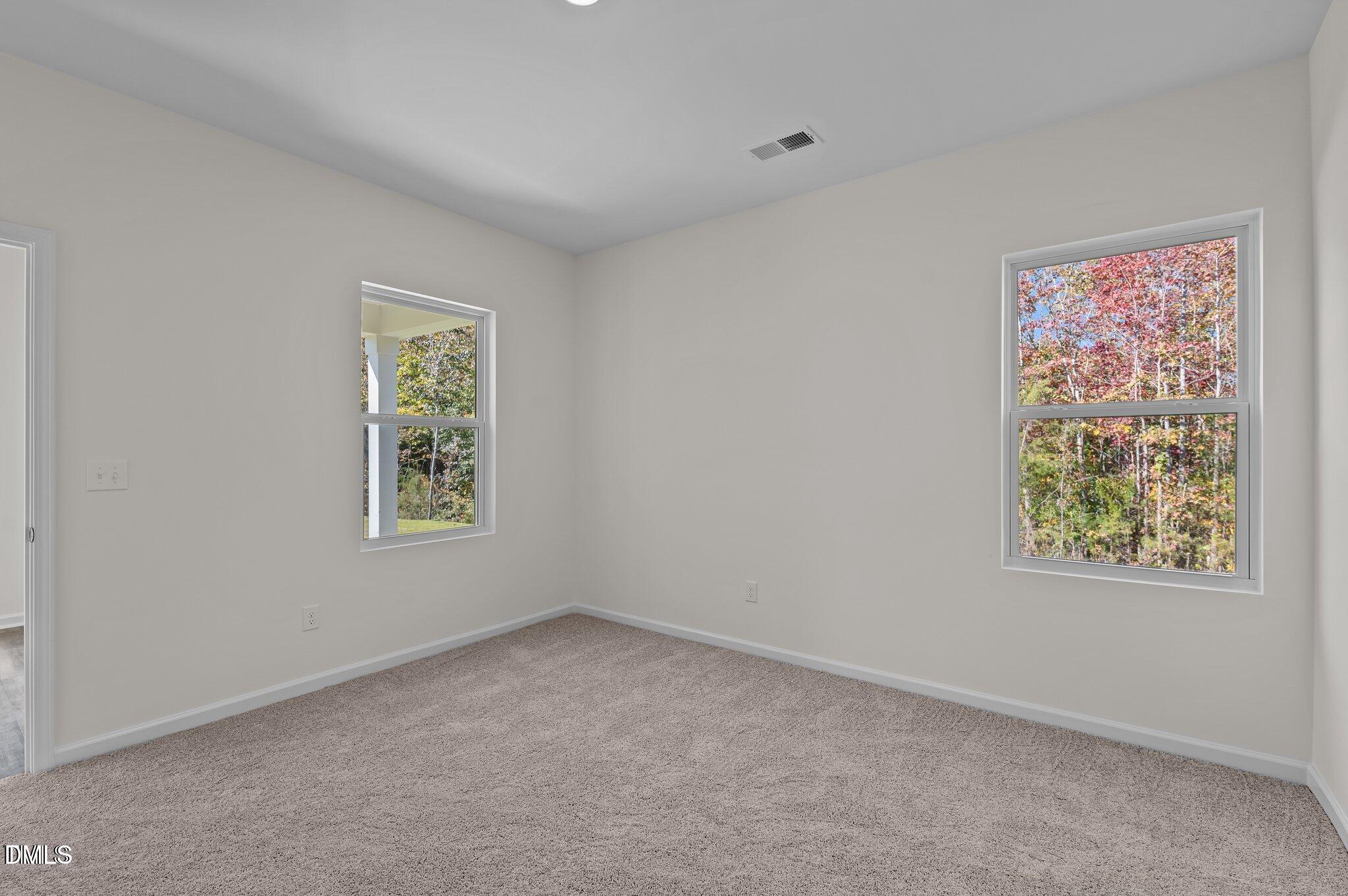 646 Essex Road Nashville, NC 27856 - Photo 8 of 24 an empty room with windows