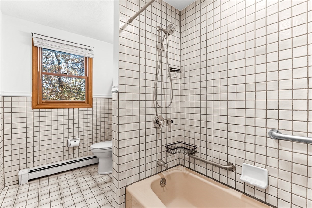 25 Murdoch Road Stoneham, MA 02180 - Photo 14 of 39 a bathroom with a sink a toilet and shower