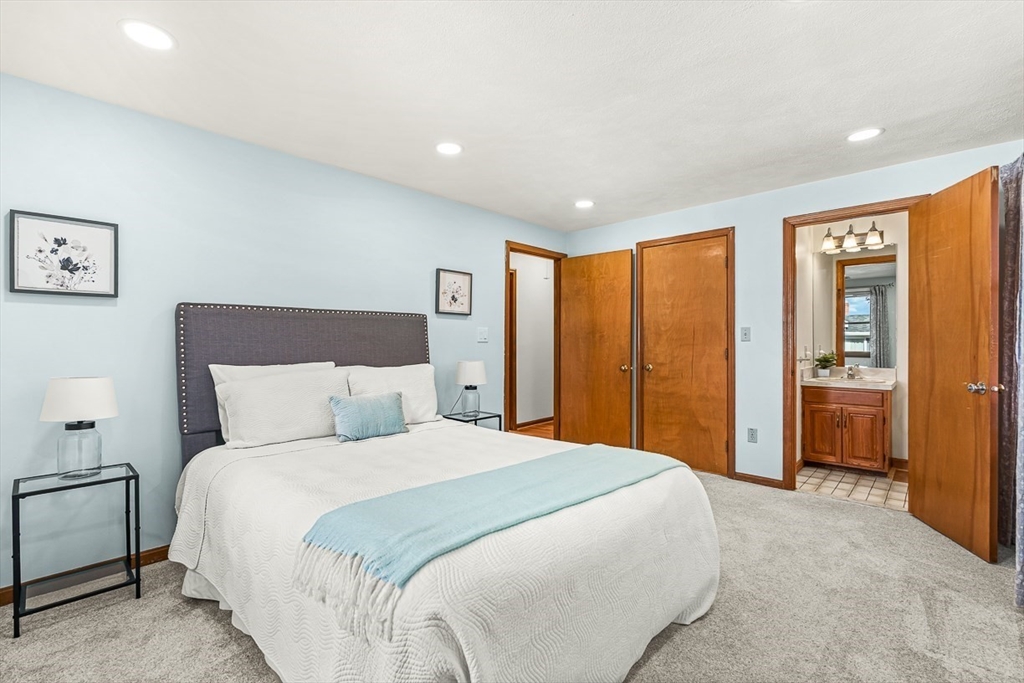 25 Murdoch Road Stoneham, MA 02180 - Photo 16 of 39 a bedroom with a large bed and a large window