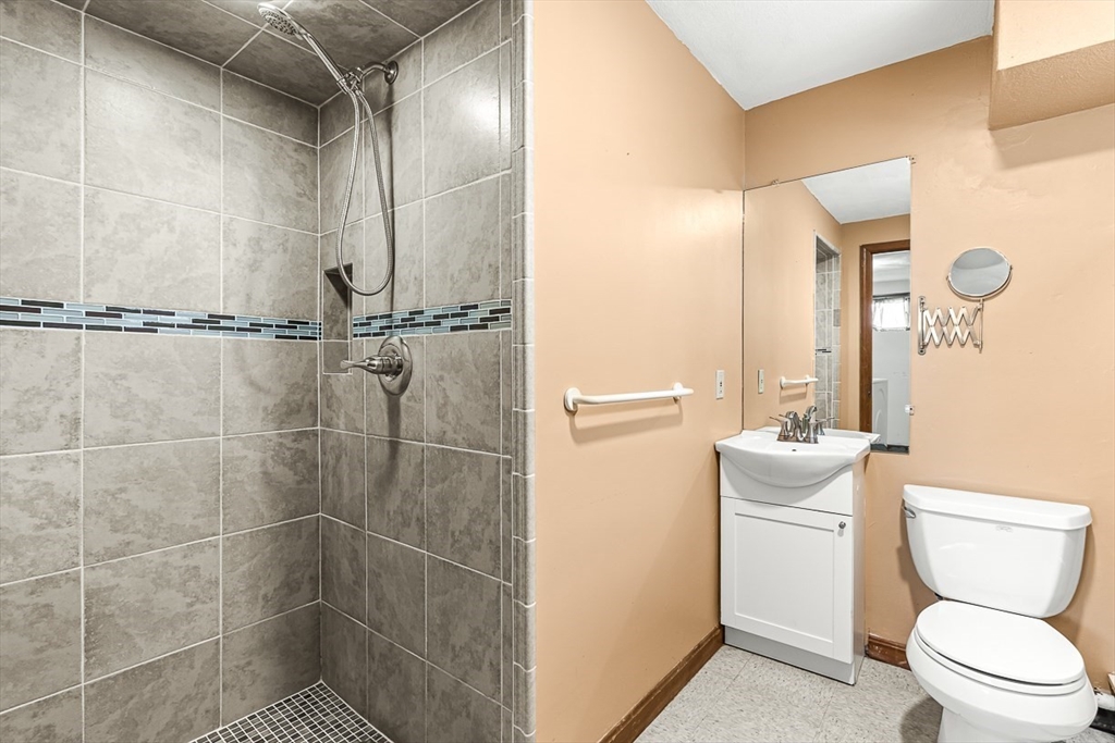 25 Murdoch Road Stoneham, MA 02180 - Photo 28 of 39 a bathroom with a toilet a sink and shower