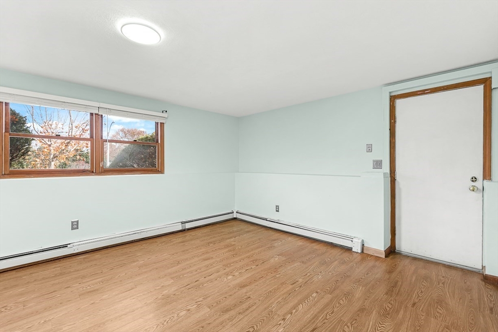 25 Murdoch Road Stoneham, MA 02180 - Photo 31 of 39 an empty room with wooden floor and window