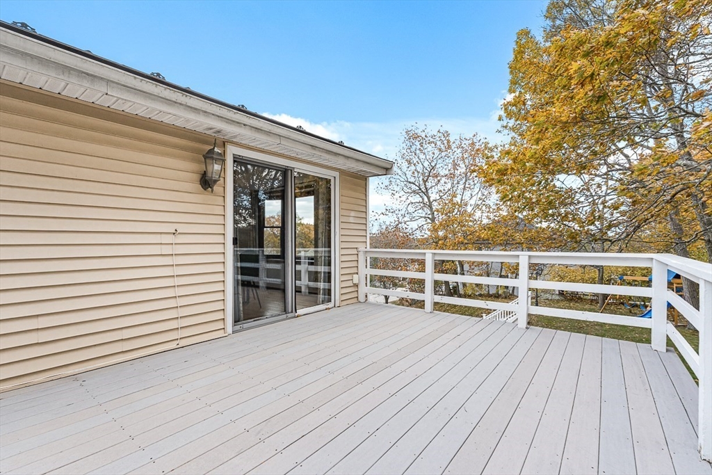 25 Murdoch Road Stoneham, MA 02180 - Photo 35 of 39 a view of a balcony with wooden floor and fence