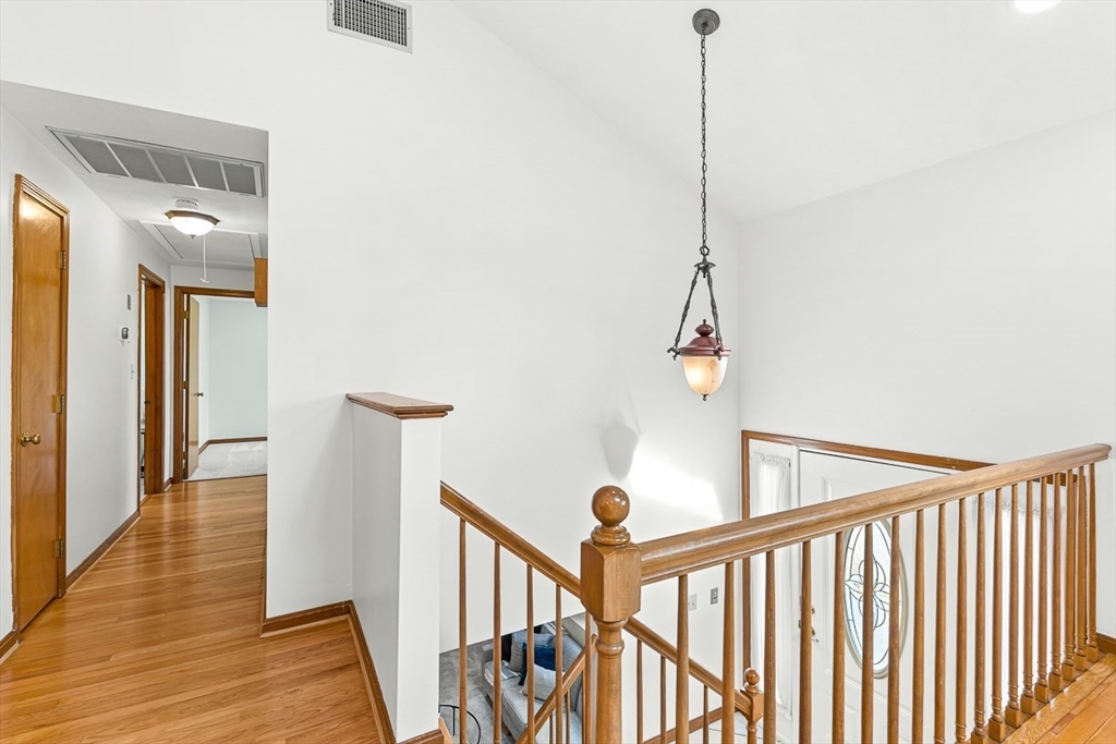 25 Murdoch Road Stoneham, MA 02180 - Photo 4 of 39 a view of a hallway with wooden floor