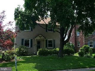28 Upland Road Havertown, PA 19083 - Photo 1 of 1 a front view of a house with a yard and a tree