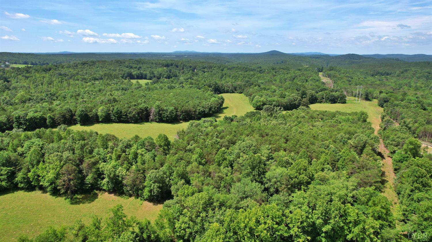 0 Storey Road Concord, VA 24538 - Photo 7 of 19 a view of a lush green field with a mountain in the background