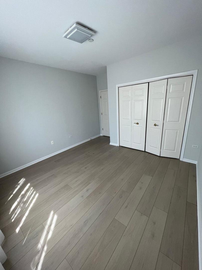 660 McHenry Road, Unit 107 Wheeling, IL 60090 - Photo 18 of 24 a view of an empty room