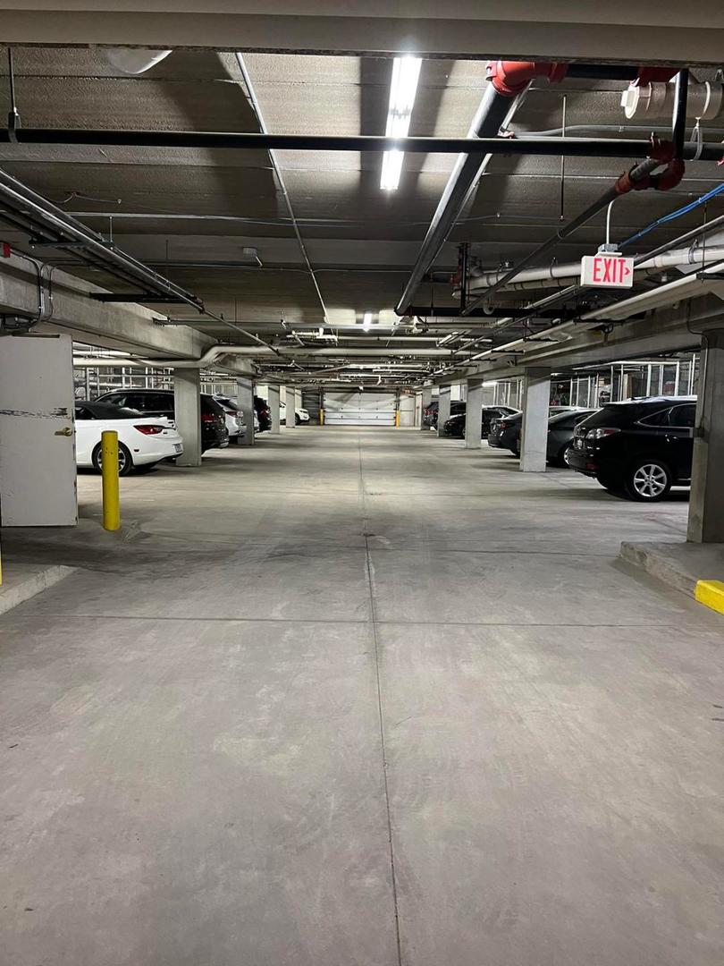 660 McHenry Road, Unit 107 Wheeling, IL 60090 - Photo 21 of 24 a view of parking garage with kitchen
