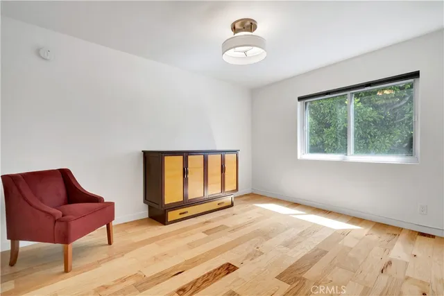 a view of a livingroom with wooden floor