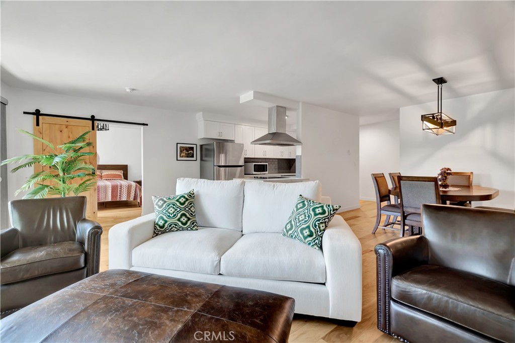 8710 Delgany Avenue, Unit 17 Playa del Rey, CA 90293 - Photo 7 of 36 a living room with furniture and kitchen view