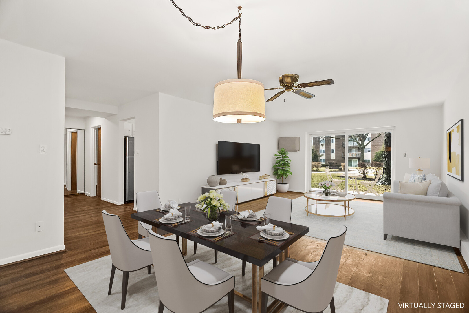 1331 South Finley Road, Unit 104 Lombard, IL 60148 - Photo 2 of 12 a living room with furniture and a flat screen tv