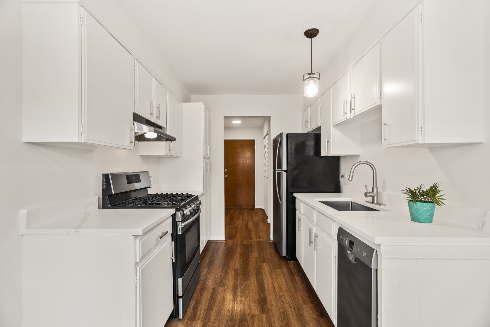1331 South Finley Road, Unit 104 Lombard, IL 60148 - Photo 6 of 12 a kitchen with a sink a stove and refrigerator
