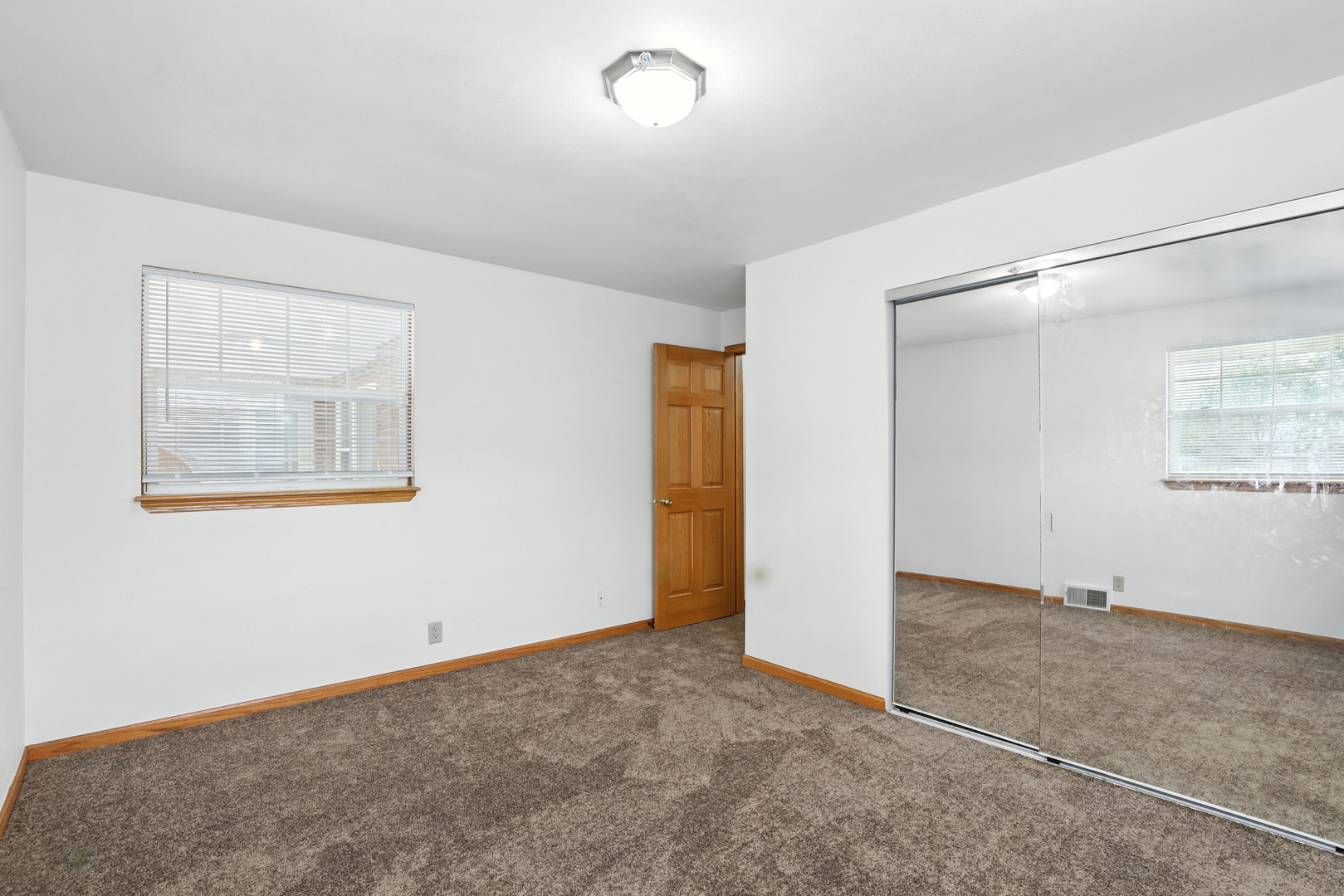 1401 20th Street Zion, IL 60099 - Photo 18 of 30 an empty room with windows and refrigerator