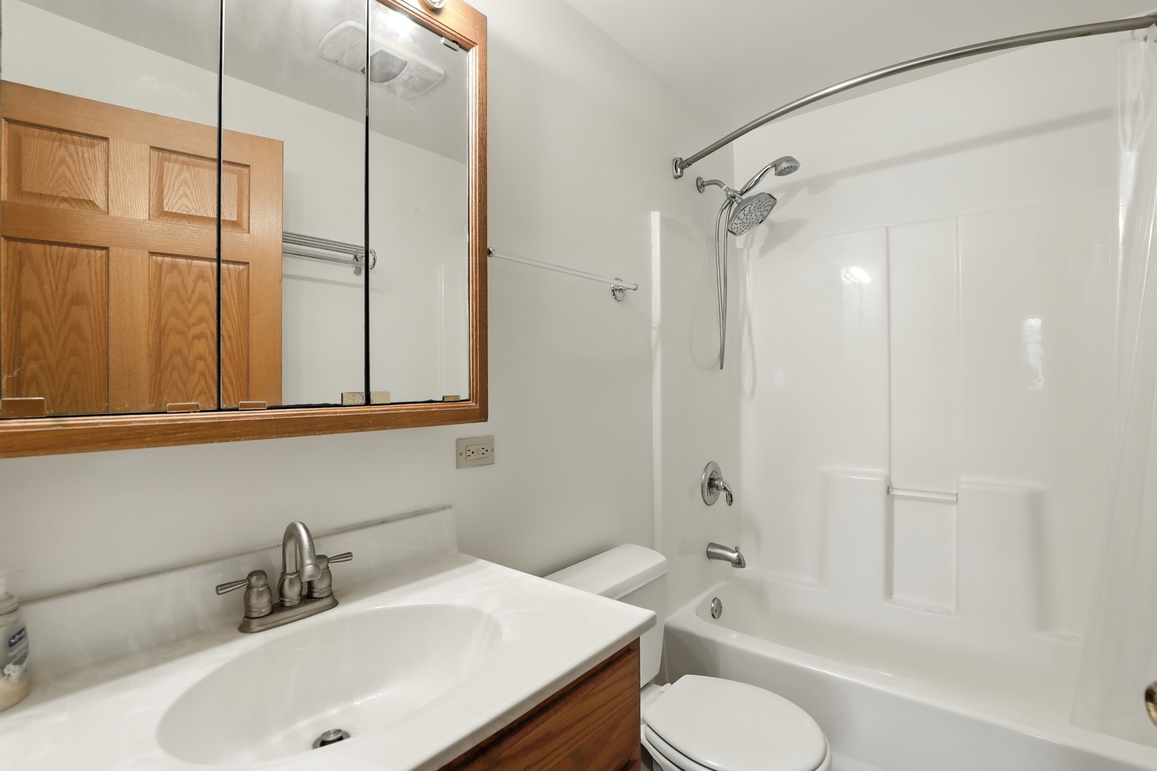1401 20th Street Zion, IL 60099 - Photo 20 of 30 a bathroom with a sink toilet and shower