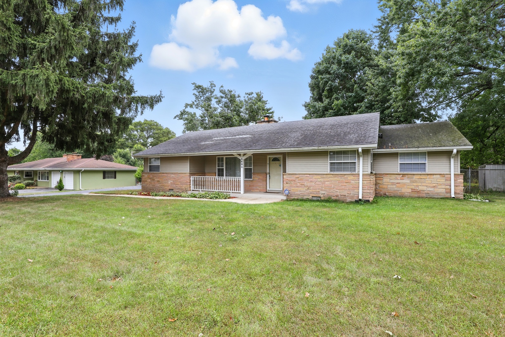1401 20th Street Zion, IL 60099 - Photo 2 of 30 a front view of a house with a garden