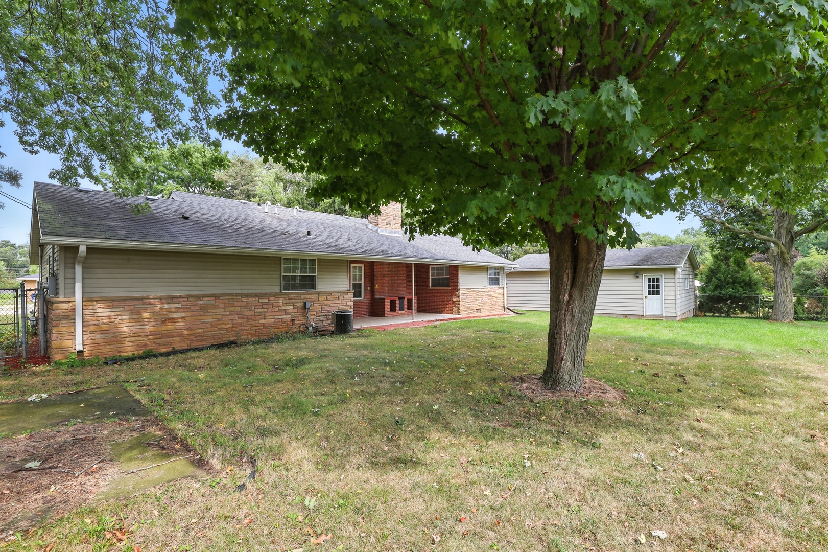 1401 20th Street Zion, IL 60099 - Photo 28 of 30 a view of a house with a yard and tree