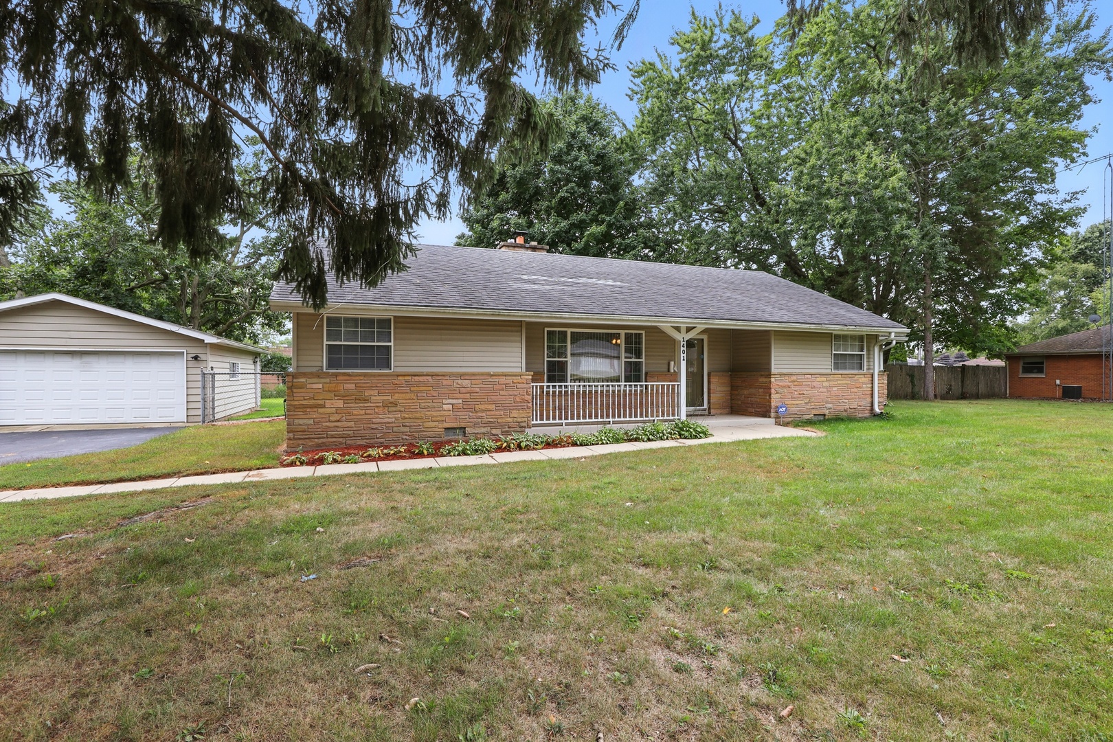 1401 20th Street Zion, IL 60099 - Photo 29 of 30 a front view of a house with a garden