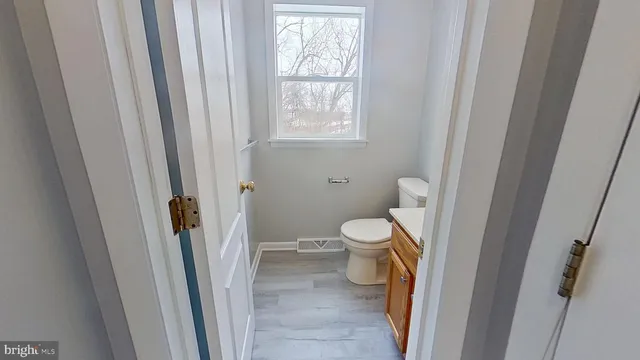 a view of staircase with wooden floor