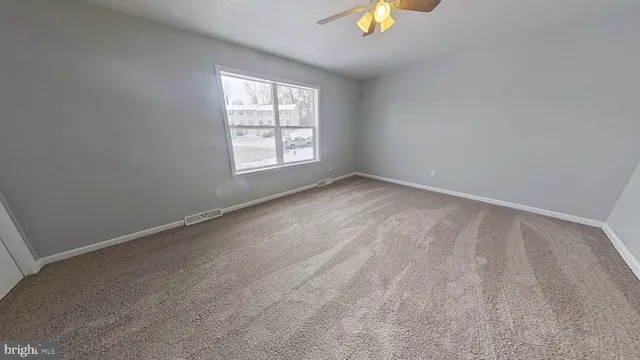 a view of a hallway with windows
