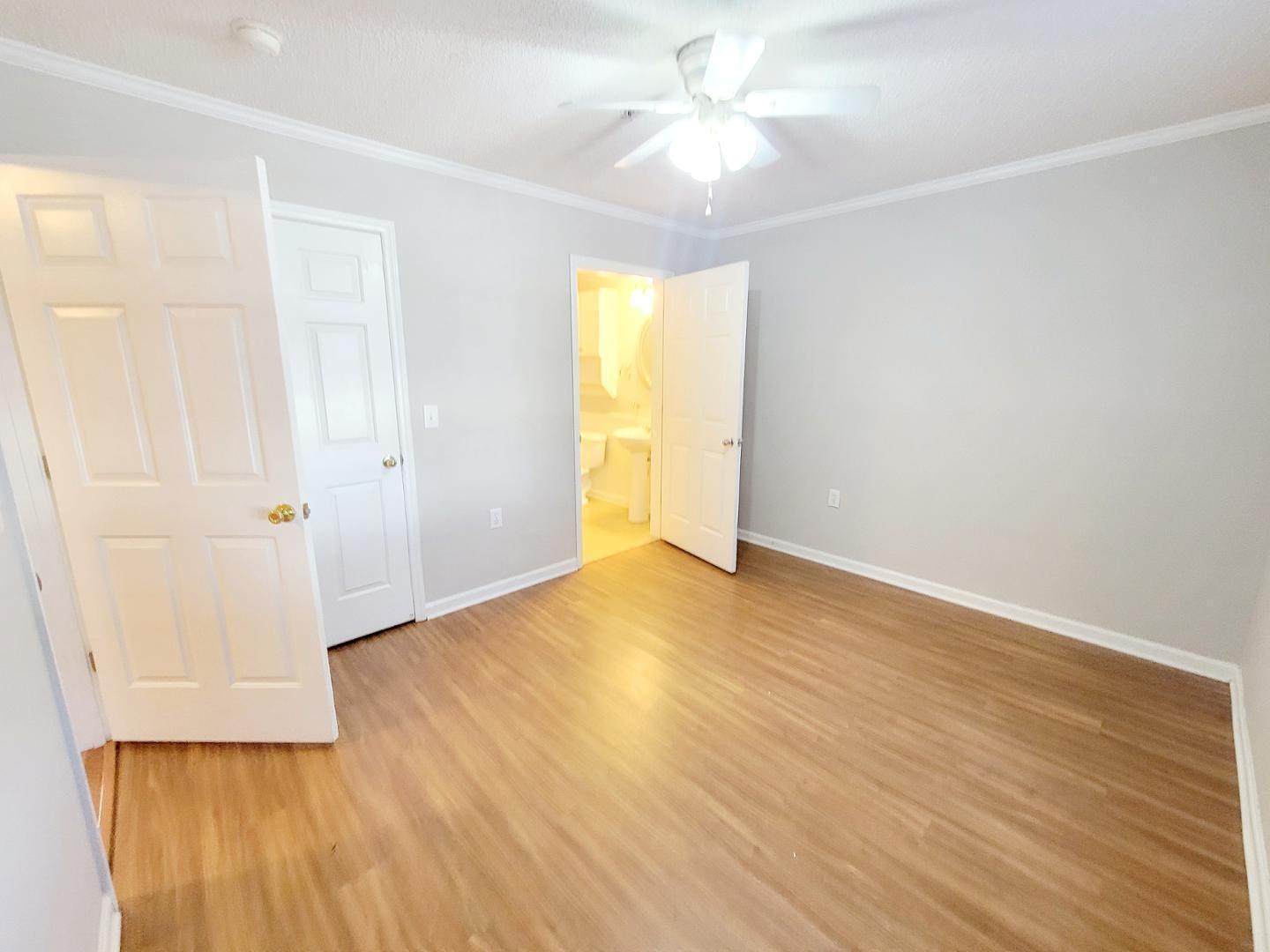 3770 Pardue Woods Place, Unit 103 Raleigh, NC 27603 - Photo 26 of 42 an empty room with wooden floor and windows