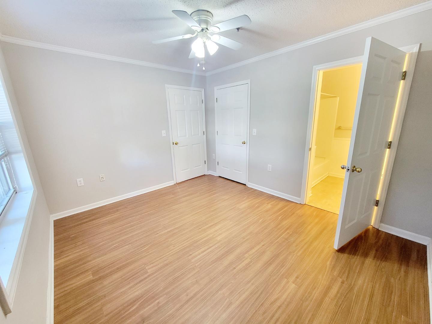 3770 Pardue Woods Place, Unit 103 Raleigh, NC 27603 - Photo 27 of 42 wooden floor in an empty room with a window