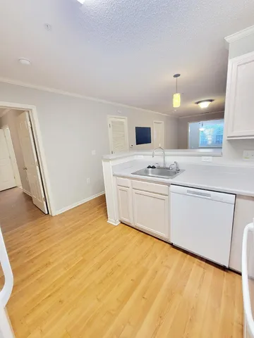 a view of kitchen with furniture and wooden floor