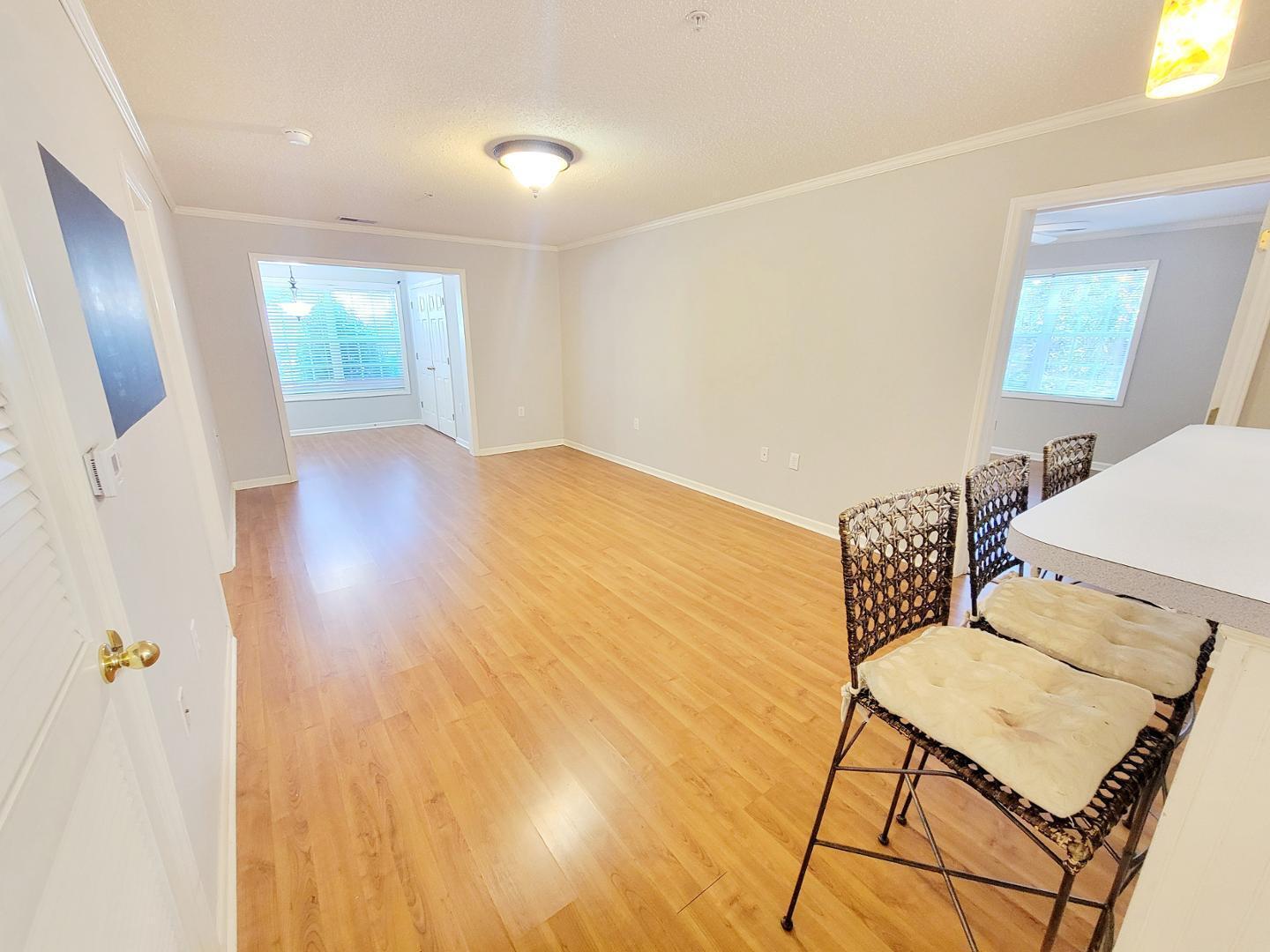3770 Pardue Woods Place, Unit 103 Raleigh, NC 27603 - Photo 7 of 42 a view of kitchen with furniture and wooden floor