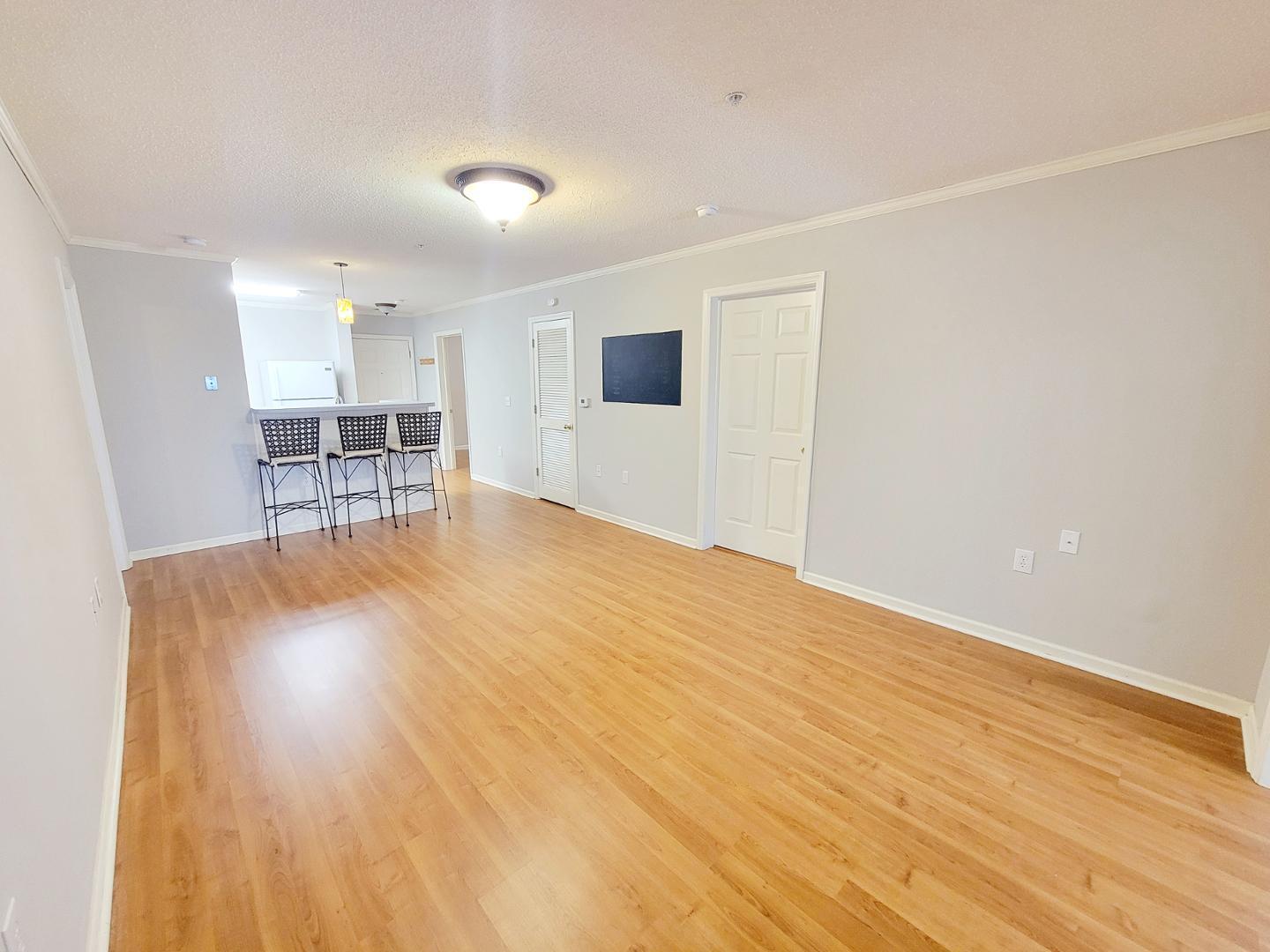 3770 Pardue Woods Place, Unit 103 Raleigh, NC 27603 - Photo 9 of 42 a view of a room with wooden floor