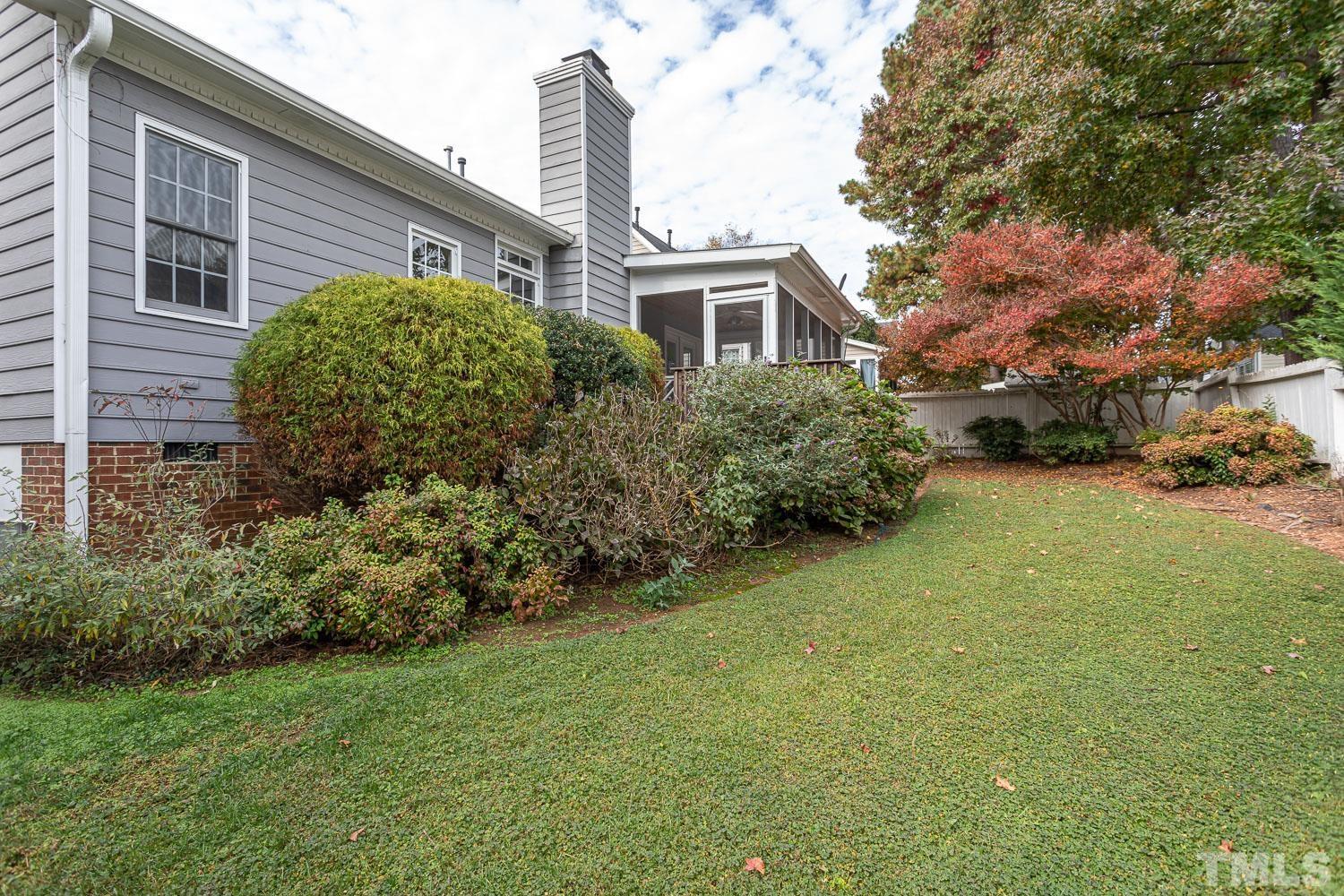 8669 Harps Mill Road Raleigh, NC 27615 - Photo 12 of 13 a view of a house with backyard and garden
