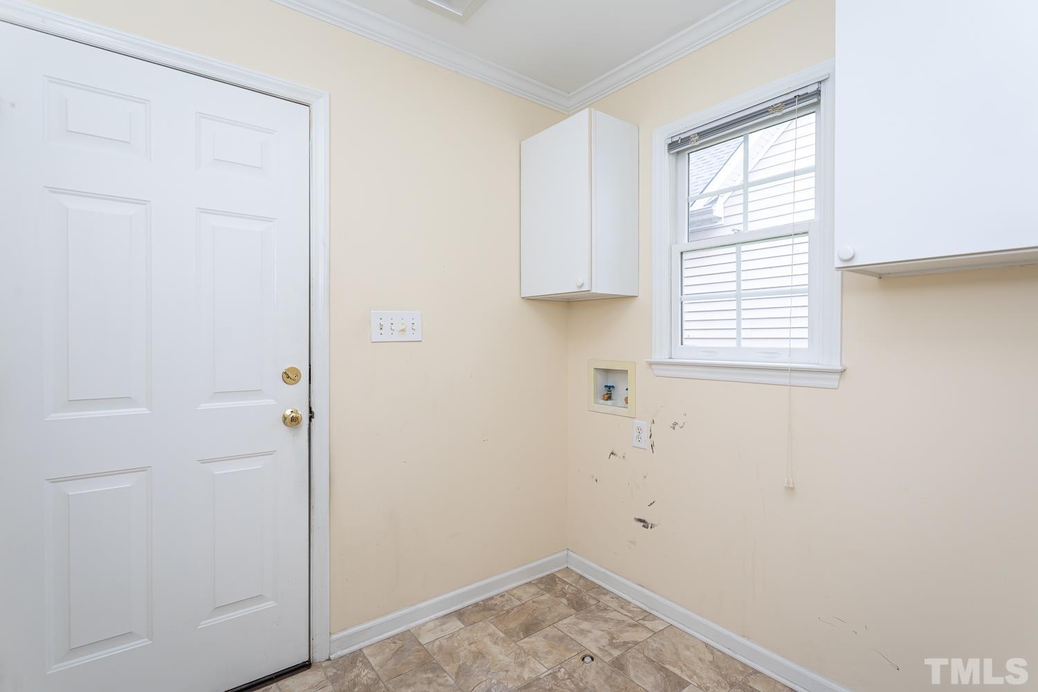 8669 Harps Mill Road Raleigh, NC 27615 - Photo 10 of 13 a view of a room that has a window in it