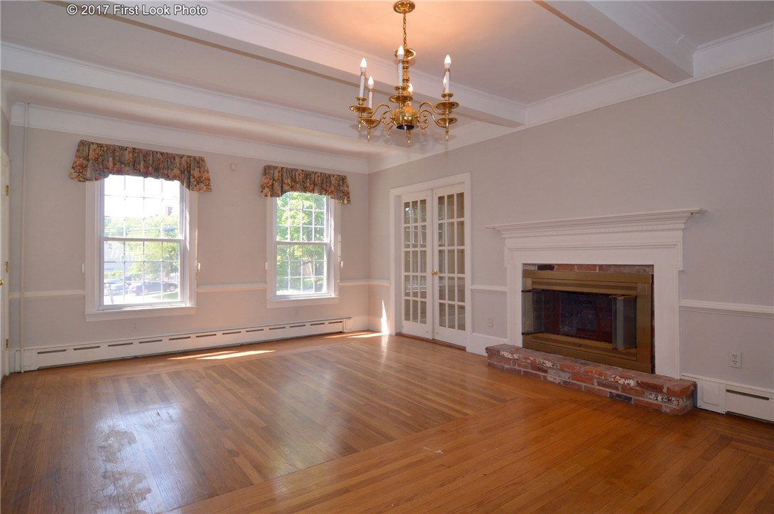 1368 Main Road Tiverton, RI 02878 - Photo 14 of 35 LIVING RM IS FRONT TO BACK WITH BEAMED CEILING
