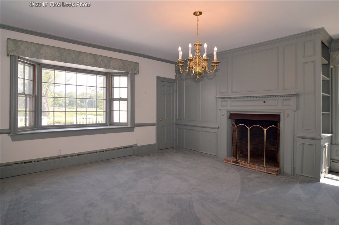 1368 Main Road Tiverton, RI 02878 - Photo 19 of 35 LIVING RM OFF THE KITCHEN WITH DINING RM USE AND ACCESS TO REAR STAIRWAY