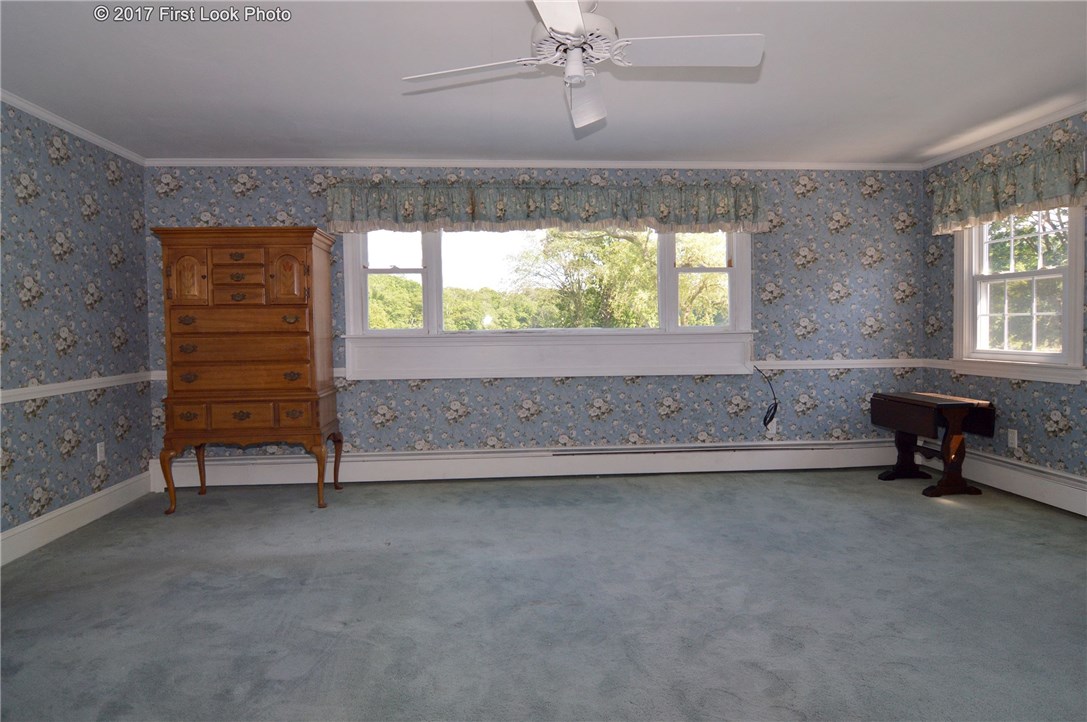 1368 Main Road Tiverton, RI 02878 - Photo 23 of 35 MASTER BEDROOM SUITE PICTURE WINDOW OVERLOOKS CREAMER POND