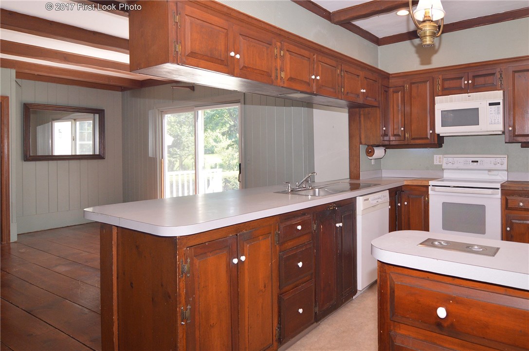 1368 Main Road Tiverton, RI 02878 - Photo 7 of 35 KITCHEN OPENS TO FAMILY ROOM AND SIDE DECK