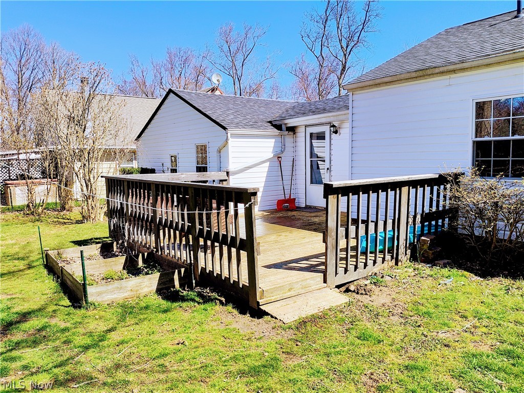 1870 Benjamin Road Madison, OH 44057 - Photo 23 of 30 Back of house featuring a yard and a deck