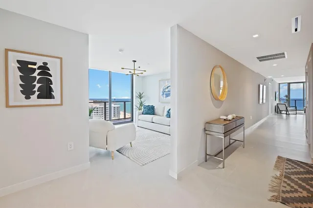 a spacious bedroom with a large bed and a large window