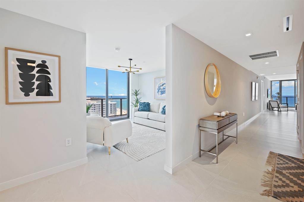 1116 North Ocean Boulevard, Unit 1606 Pompano Beach, FL 33062 - Photo 14 of 83 a living room with furniture and a large window