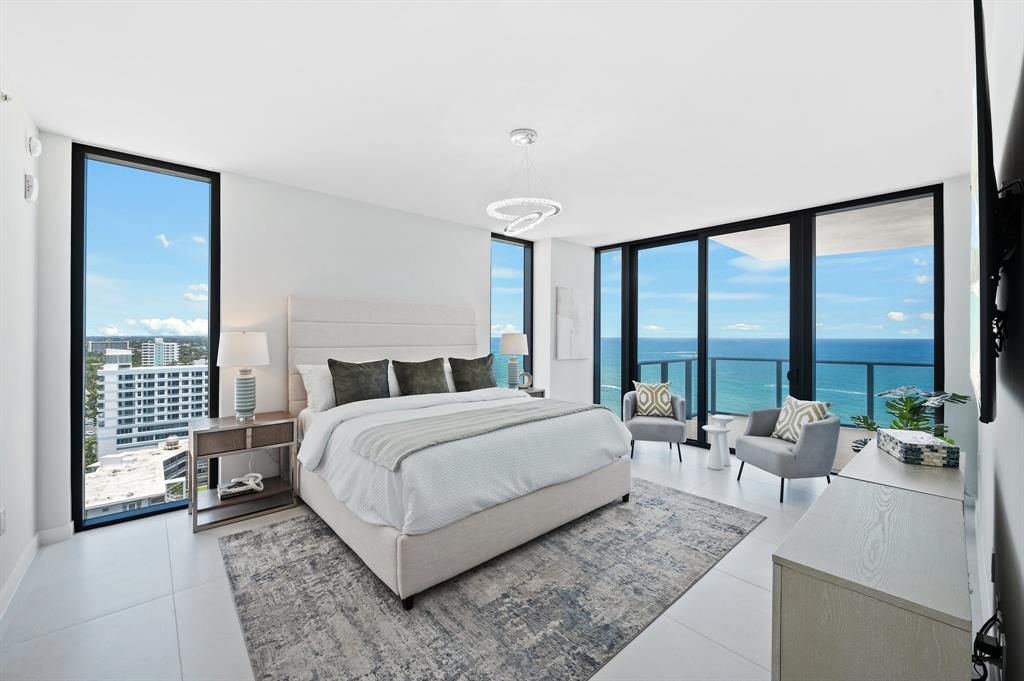 1116 North Ocean Boulevard, Unit 1606 Pompano Beach, FL 33062 - Photo 17 of 83 a spacious bedroom with a large bed and a large window