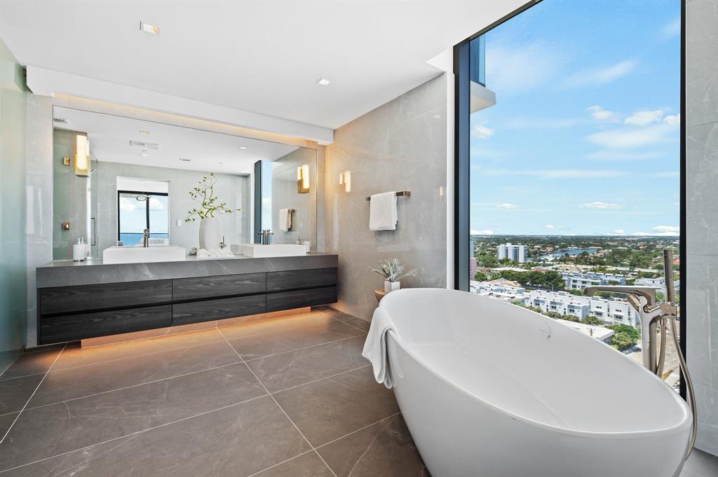 1116 North Ocean Boulevard, Unit 1606 Pompano Beach, FL 33062 - Photo 19 of 83 a spacious bathroom with a bathtub and a sink